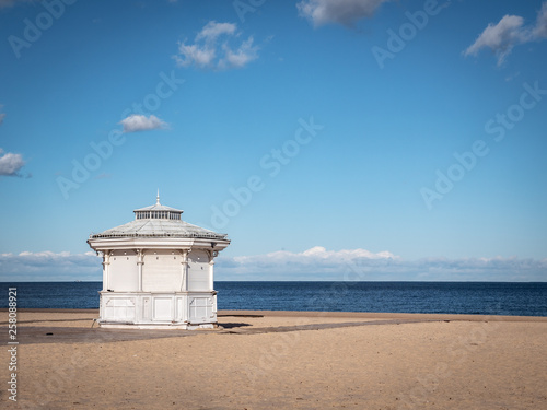 Scenic view of the beach with white small kiosk