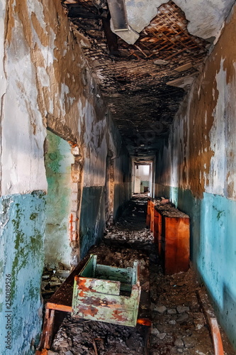 Dark creepy corridor of abandoned building