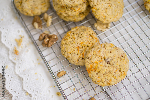 Oatmeal carrot cookies with nuts and milk close up selective focus