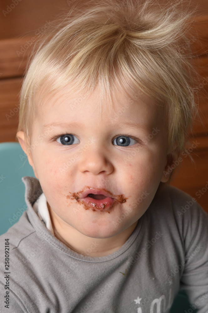 child with chocolate on the mouth child with chocolate on the mouth