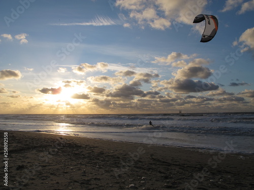 Kitesurfing with sunset