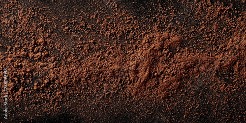Cocoa powder isolated on black background and texture photo
