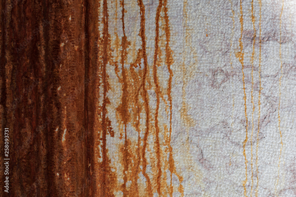 Wall with rust runoff, can be used as a background.