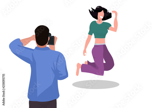 professional man photographer shooting beautiful woman model girl jumping mid-air shoot modern photo studio white background horizontal