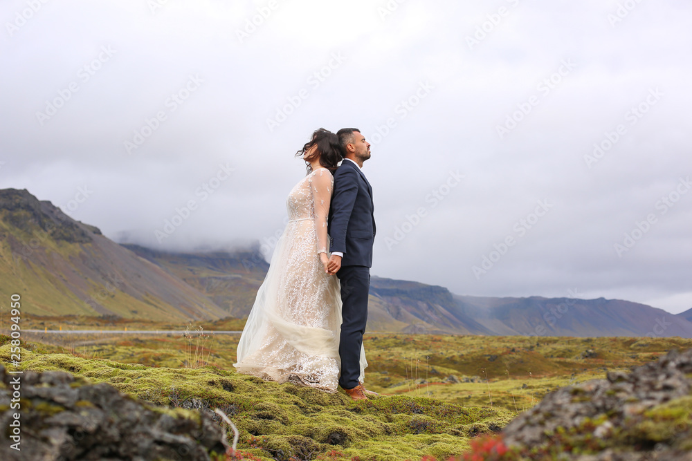 Beautiful wedding couple posing outdoor