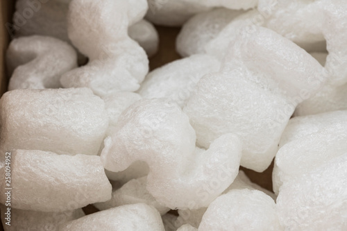 S-shaped white packing peanuts as a background - Bilder