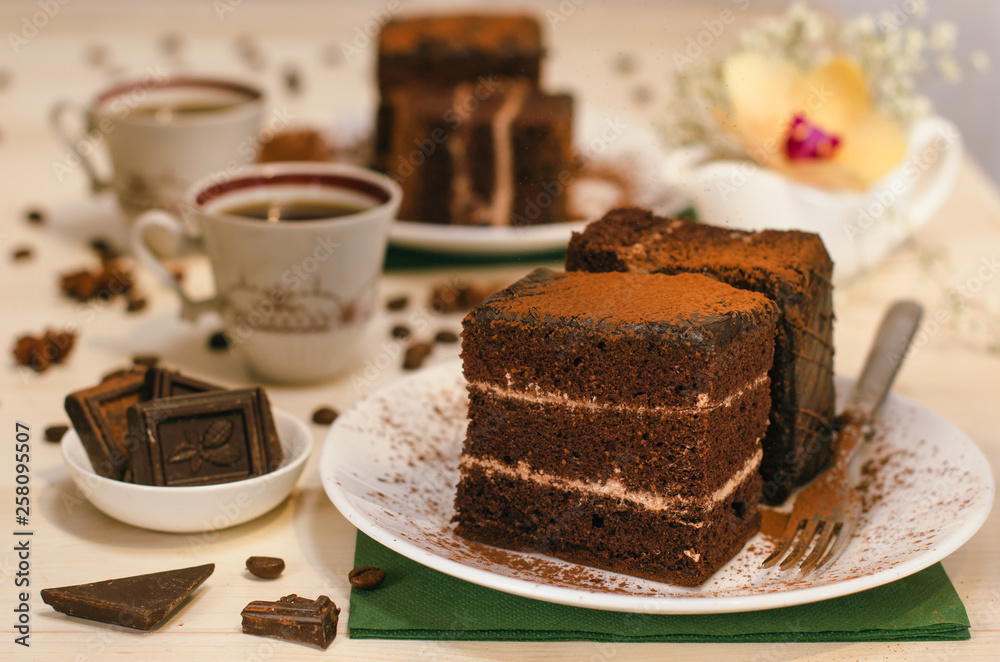 Still life on the table. Sweet cake and a hot drink . chocolate cake . Still life on the table. Sweet cake and a hot drink . chocolate cake .