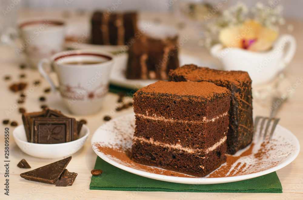 Still life on the table. Sweet cake and a hot drink . chocolate cake . Still life on the table. Sweet cake and a hot drink . chocolate cake .
