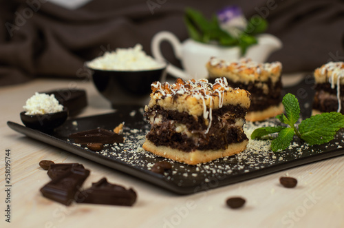 Still life on the table. Sweet cake grated pie and a hot drink .