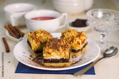 Still life on the table. Sweet cake and a hot drink .