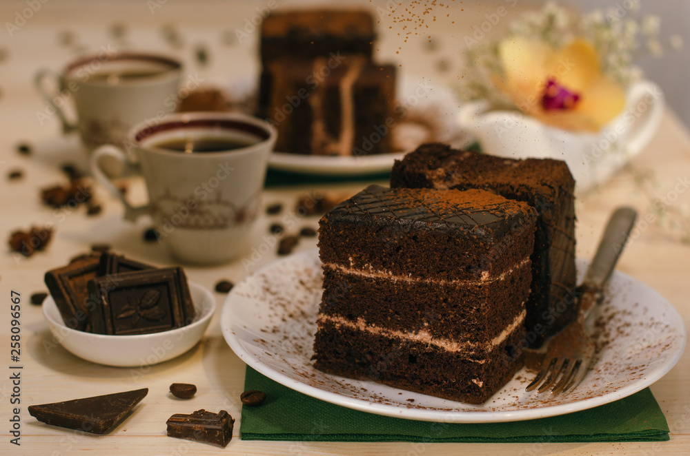 Still life on the table. Sweet cake and a hot drink . chocolate cake . Still life on the table. Sweet cake and a hot drink . chocolate cake .