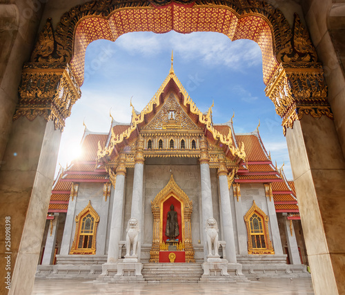 The Marble Temple or Wat Benchamabophit Dusit Wanaram in morning time with sun beam on top of church, famous landmark place for tourist sight seeing in Bangkok Thailand © asiandelight
