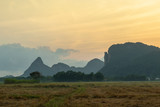 mountain and rice field in the morning with flare light at Phatthalung, Thailand