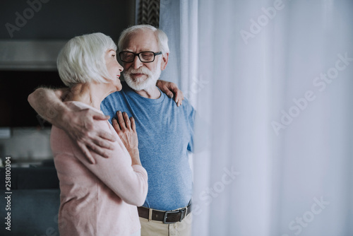 Happy pensioner couple enjoying time at home