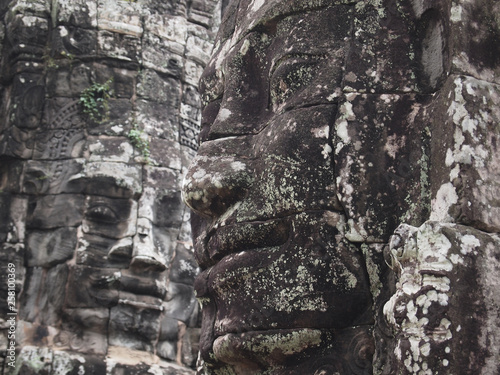 Ancient stone Buddha face closeup.