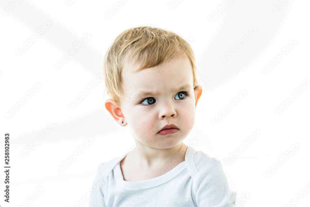 thoughtful baby with blonde hair looking away isolated on white thoughtful baby with blonde hair looking away isolated on white