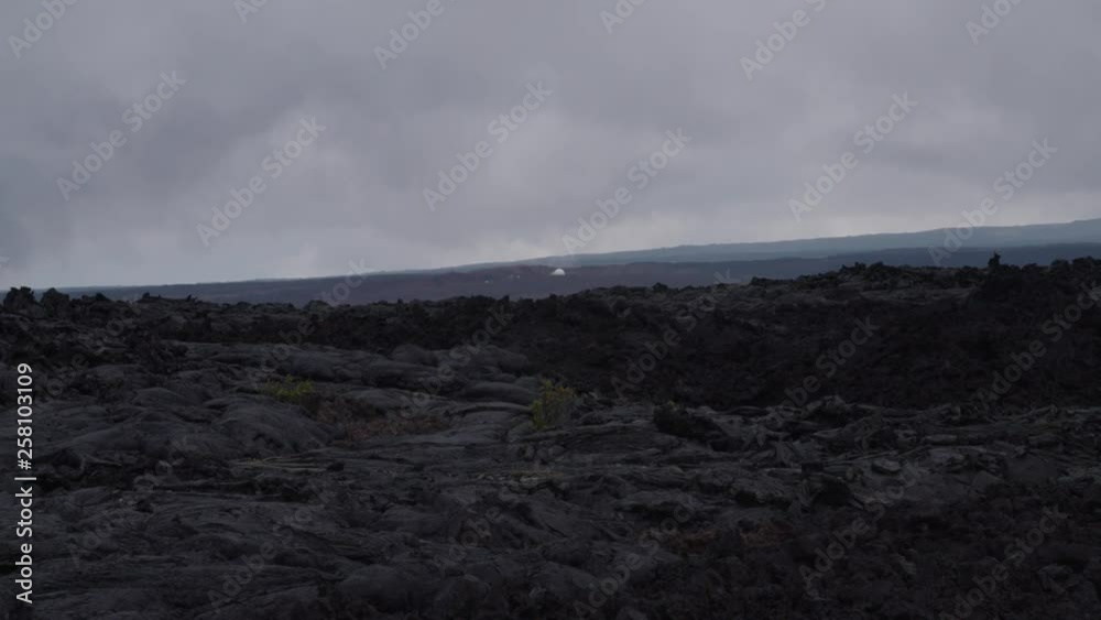 Desolate landscape in Hawaii with the Hi-Seas base in the background Desolate landscape in Hawaii with the Hi-Seas base in the background