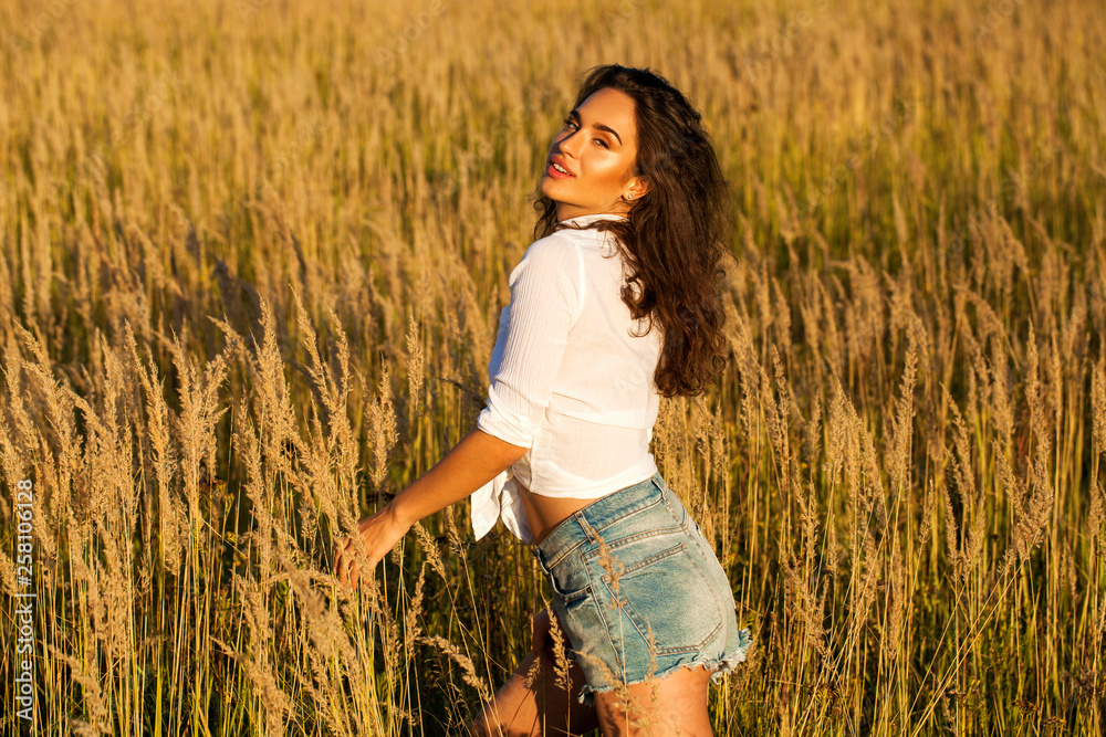 Beautiful young brunette woman in countryside Beautiful young brunette woman in countryside