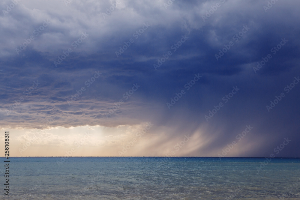Element in the sea. The beginning of the storm. The storm is coming. Strip of rain. Element in the sea. The beginning of the storm. The storm is coming. Strip of rain.