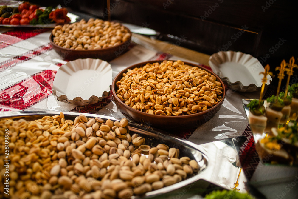 A plate of nuts on a banquet table