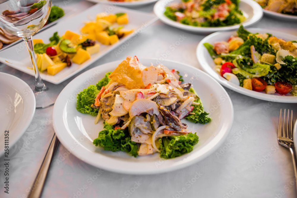 Appetizers and salads on the banquet table