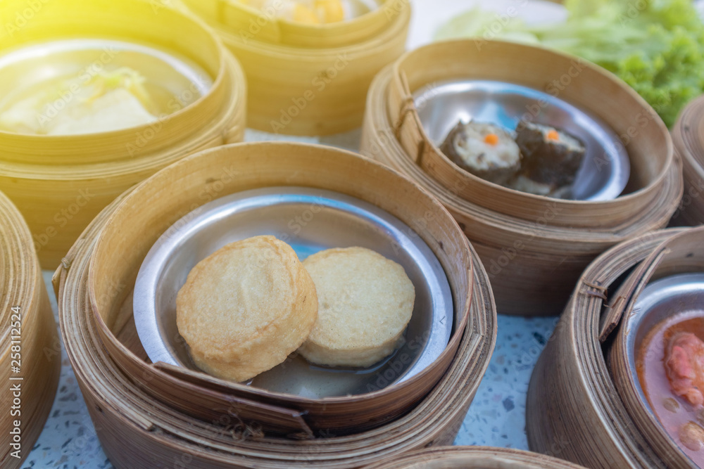 close up of variety dim sum in bamboo basket close up of variety dim sum in bamboo basket