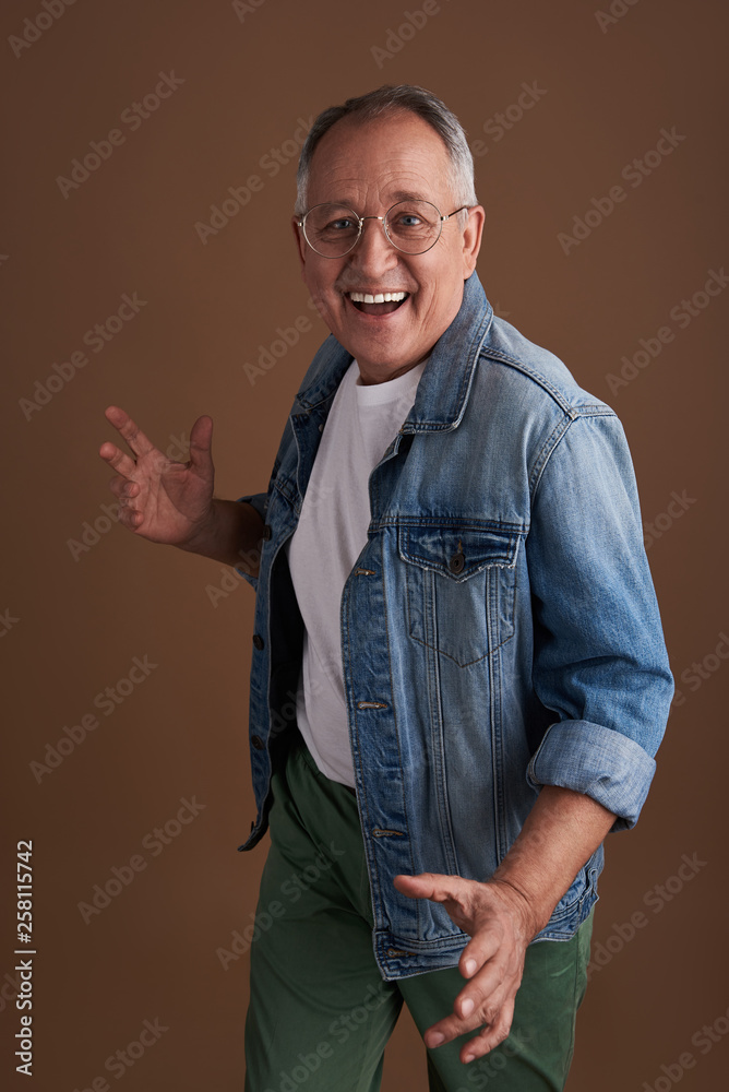 Funny happy man making gestures with his hands while posing Funny happy man making gestures with his hands while posing