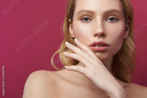 Close up portrait of graceful young blonde woman