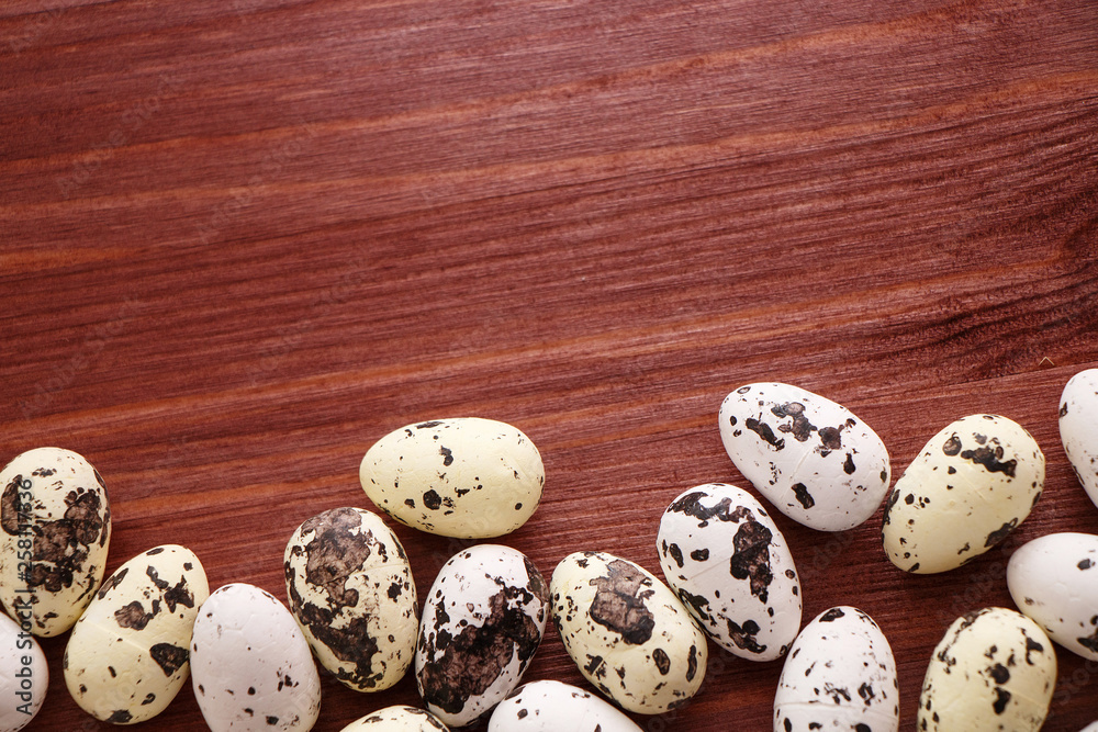 Fototapeta premium Quail eggs on the wooden table
