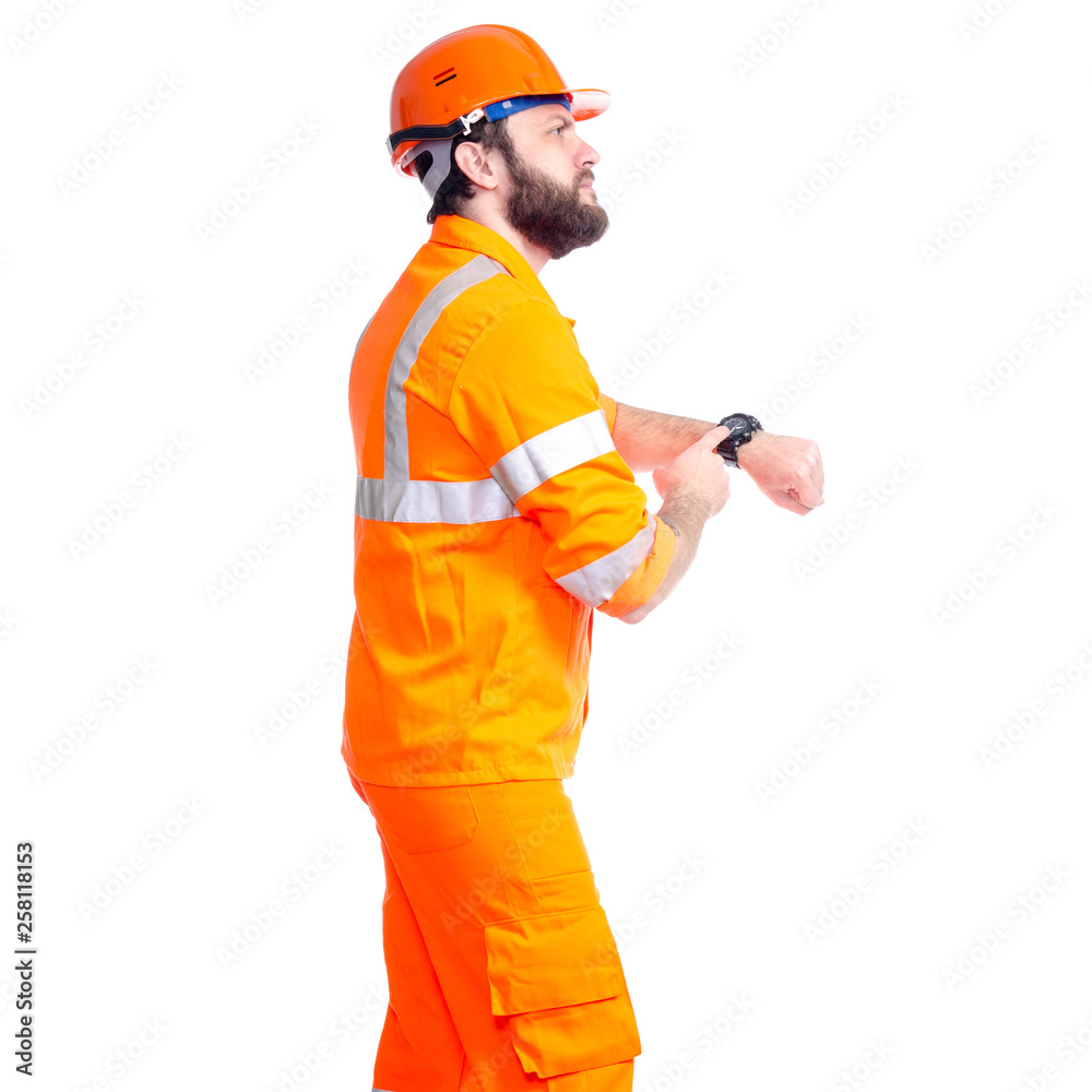 Man worker road constructor looking on watch, deadlines on white background isolation Man worker road constructor looking on watch, deadlines on white background isolation