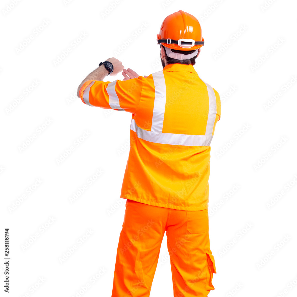 Man worker road constructor looking on watch, deadlines on white background isolation, back view Man worker road constructor looking on watch, deadlines on white background isolation, back view
