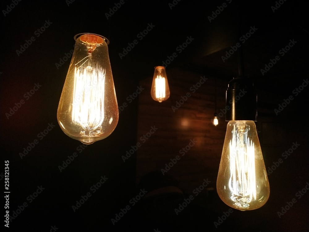 Lamps in darkness with wires hot temperature old style Lamps in darkness with wires hot temperature old style
