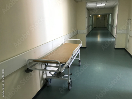 Hospital interior: view of a long corridor with light walls in the hospital