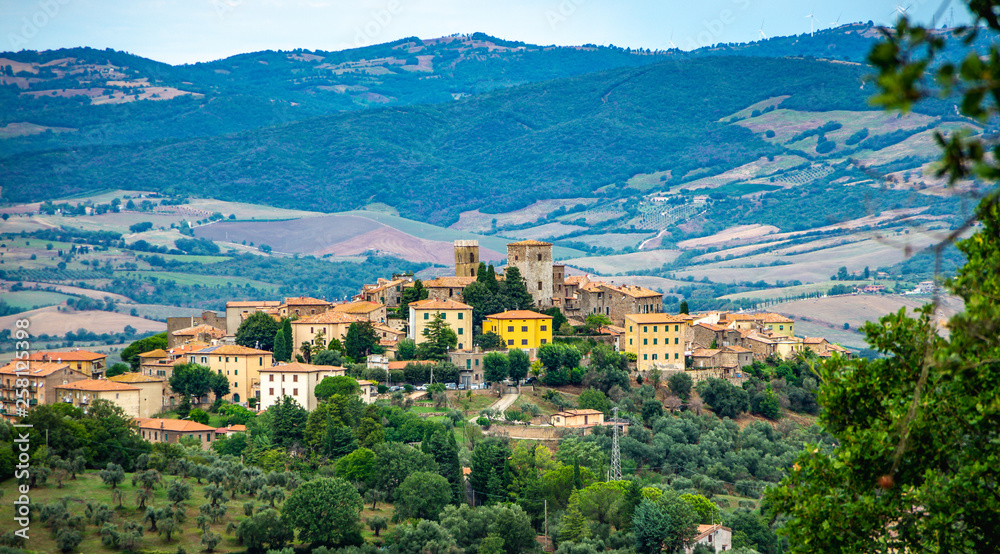 Cityscape of an old town in Maremma Region in Tuscany seen from the hill, Maremma Italy
