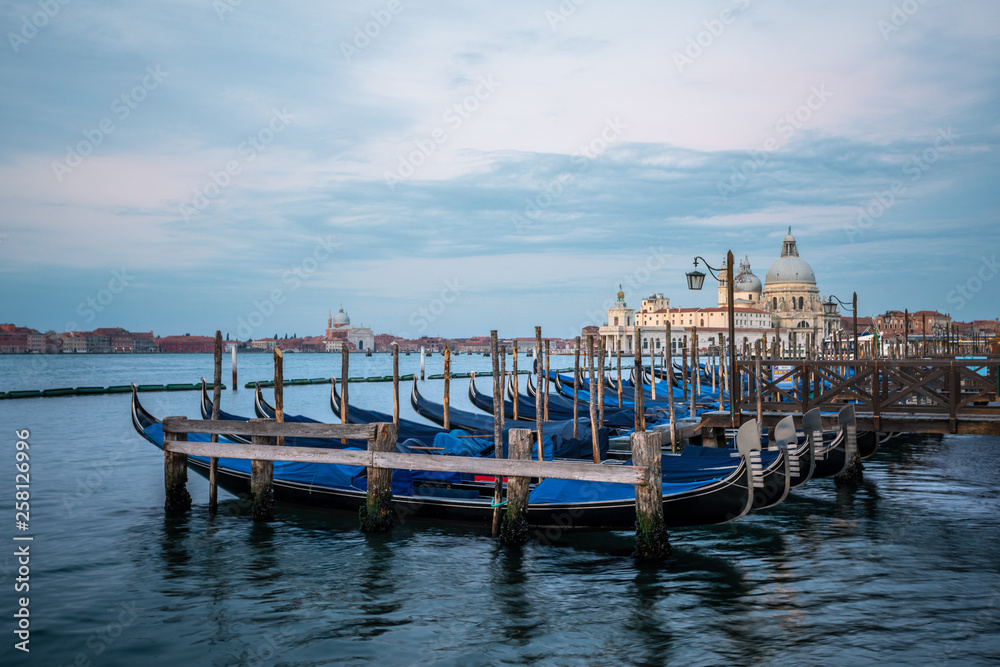 Gondolas and Santa Maria della Salute in the background in Venice, Italy Gondolas and Santa Maria della Salute in the background in Venice, Italy