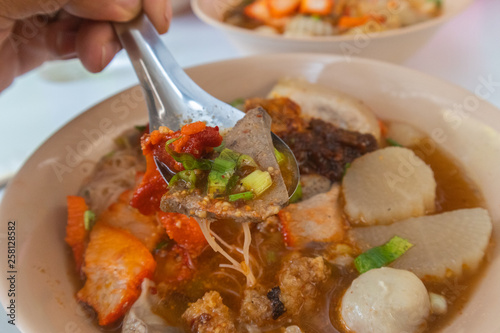 spicy tom yum noodle with pork and meat ball at thailand