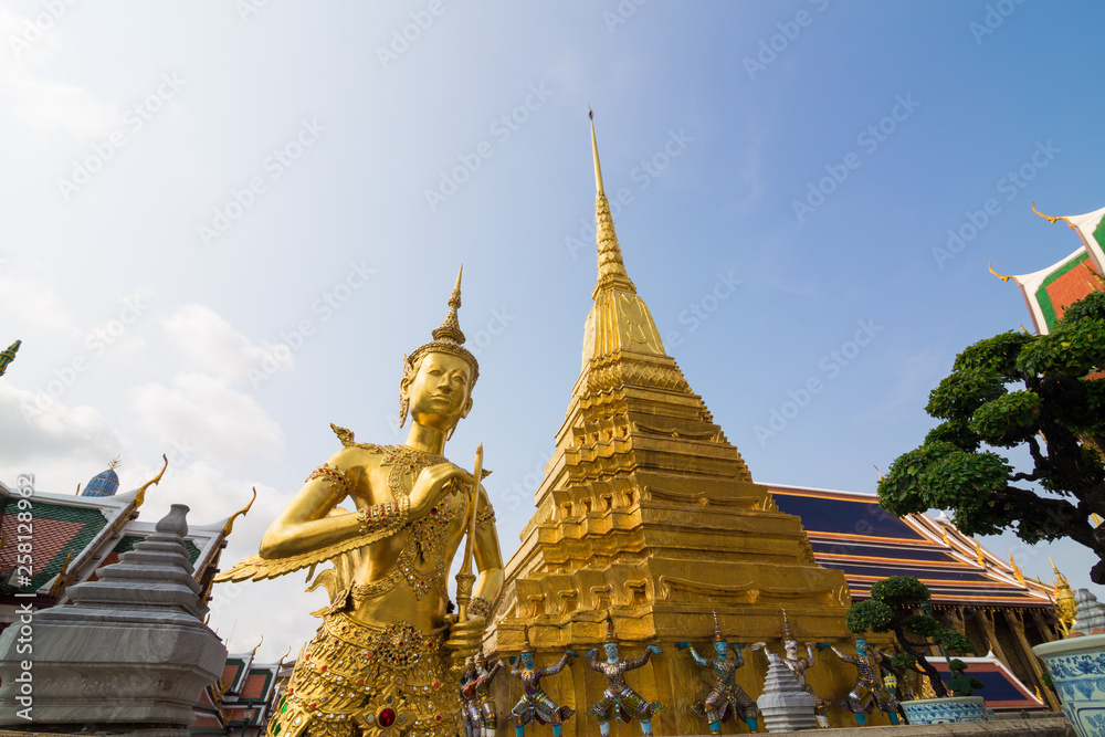 Fototapeta premium Golden angel stand in Grand palace temple Wat Phra Kaew