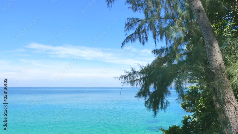 Beautiful blue sky over a calm body of water. A gentle breeze flow through the trees. Shallow clear waters off the beach. 28 seconds Beautiful blue sky over a calm body of water. A gentle breeze flow through the trees. Shallow clear waters off the beach. 28 seconds
