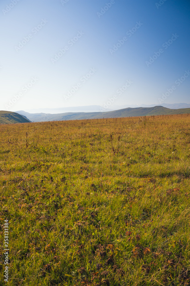 View of the small mountains at dawn in summer on the way to the Bermamyt plateau