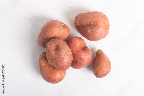 Trendy ugly organic potatoes on the table