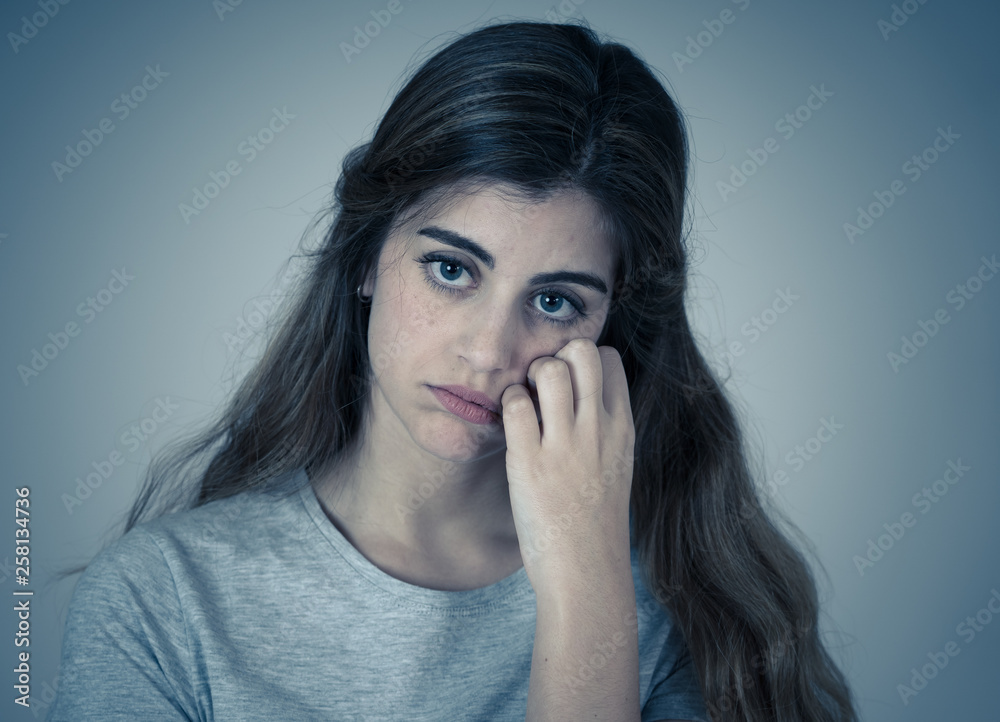 Portrait of sad and depressed woman. Isolated in white background. Human expressions and emotions Portrait of sad and depressed woman. Isolated in white background. Human expressions and emotions