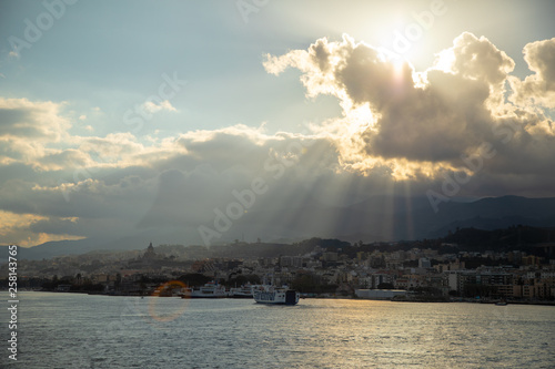 Beautiful view of cityscape and harbor of Messina from ferry, Sicily, Italy © dtatiana