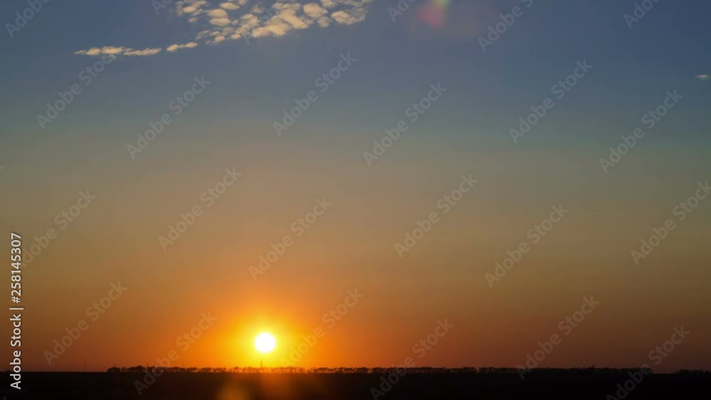 Time lapse of sunset over flat landscape with colourful sky and cirrus clouds, Ukraine. Time lapse of sunset over flat landscape with colourful sky and cirrus clouds, Ukraine.