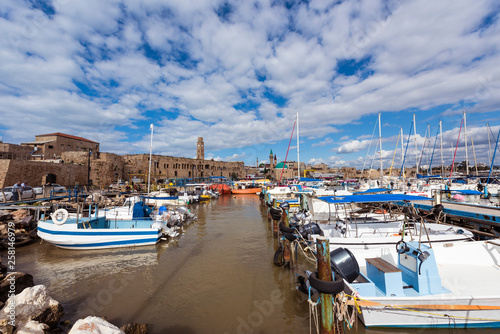 View on marina with yachts and ancient walls of harbor in old city Acre, Israel, Middle East