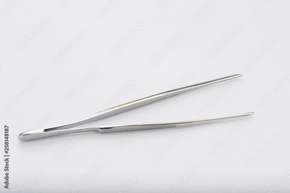 debakey forceps on the white surface debakey forceps on the white surface