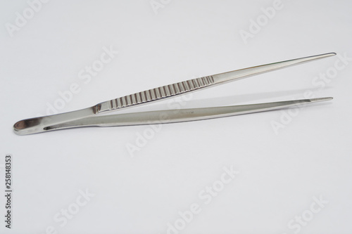debakey forceps on the white surface