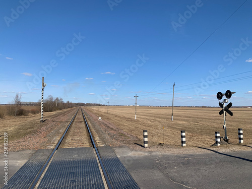 railway crossing among the field