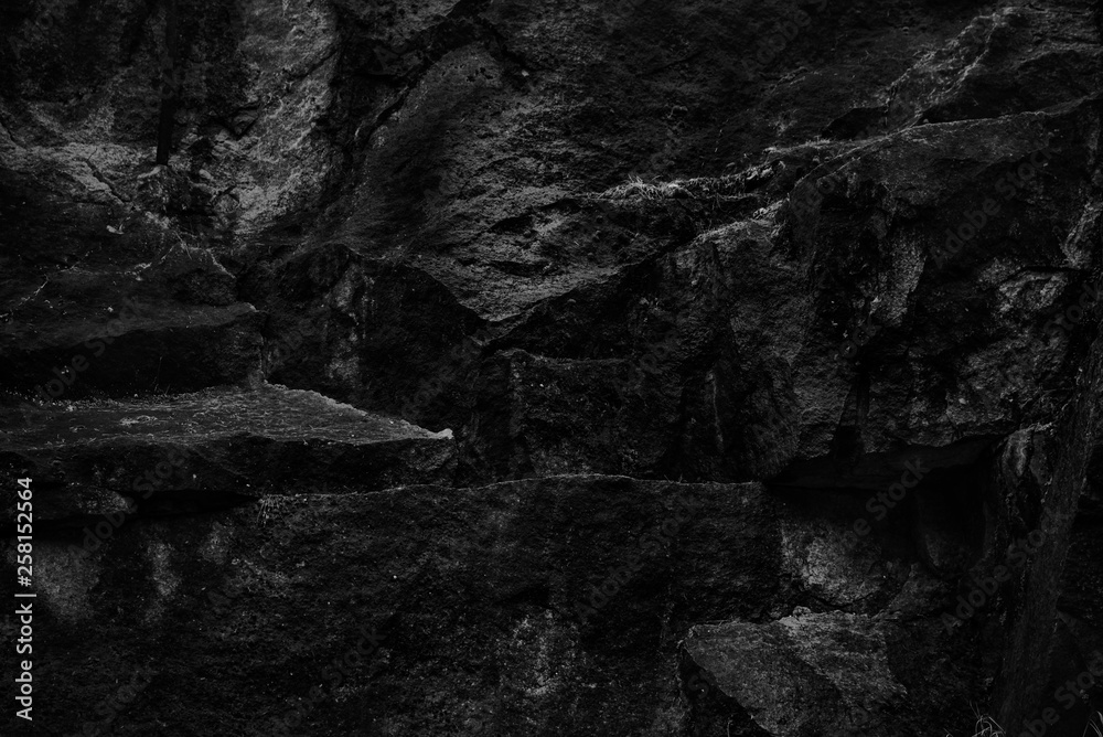 Stones texture, dark black and white background. Rock texture, natural