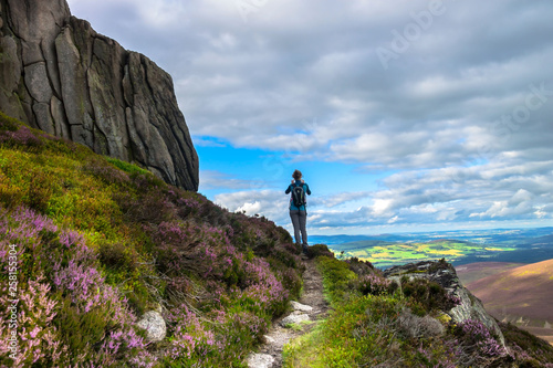 Tourist walking in Cairngorms National Park. Route to Clachnaben, Glen Dye, Aberdeenshire, Scotland, UK