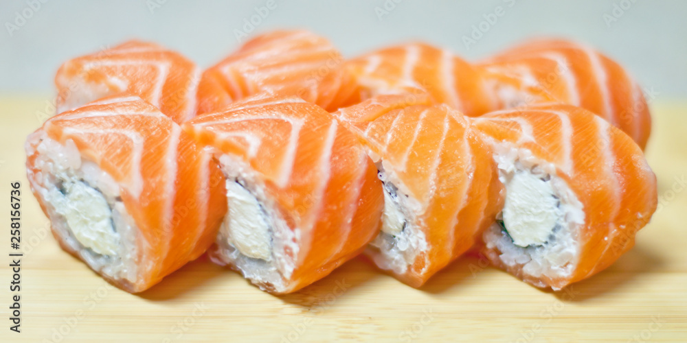 Rainbow Sushi Roll with salmon, eel, tuna, avocado, royal prawn, cream cheese Philadelphia, caviar tobica, chuka. Sushi menu. Japanese food. Rainbow Sushi Roll with salmon, eel, tuna, avocado, royal prawn, cream cheese Philadelphia, caviar tobica, chuka. Sushi menu. Japanese food.